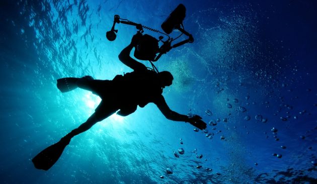 Diver with underwater camera
